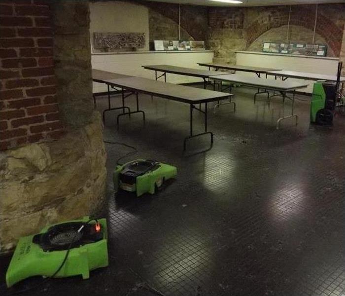 Museum, tables and two air movers (drying equipment in a museum)